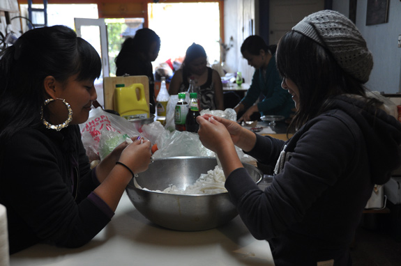 Food preparation is followed by a shared meal and storytelling sessions, where both the community elders and young women are encouraged to share. Photo: Amy Kitchener